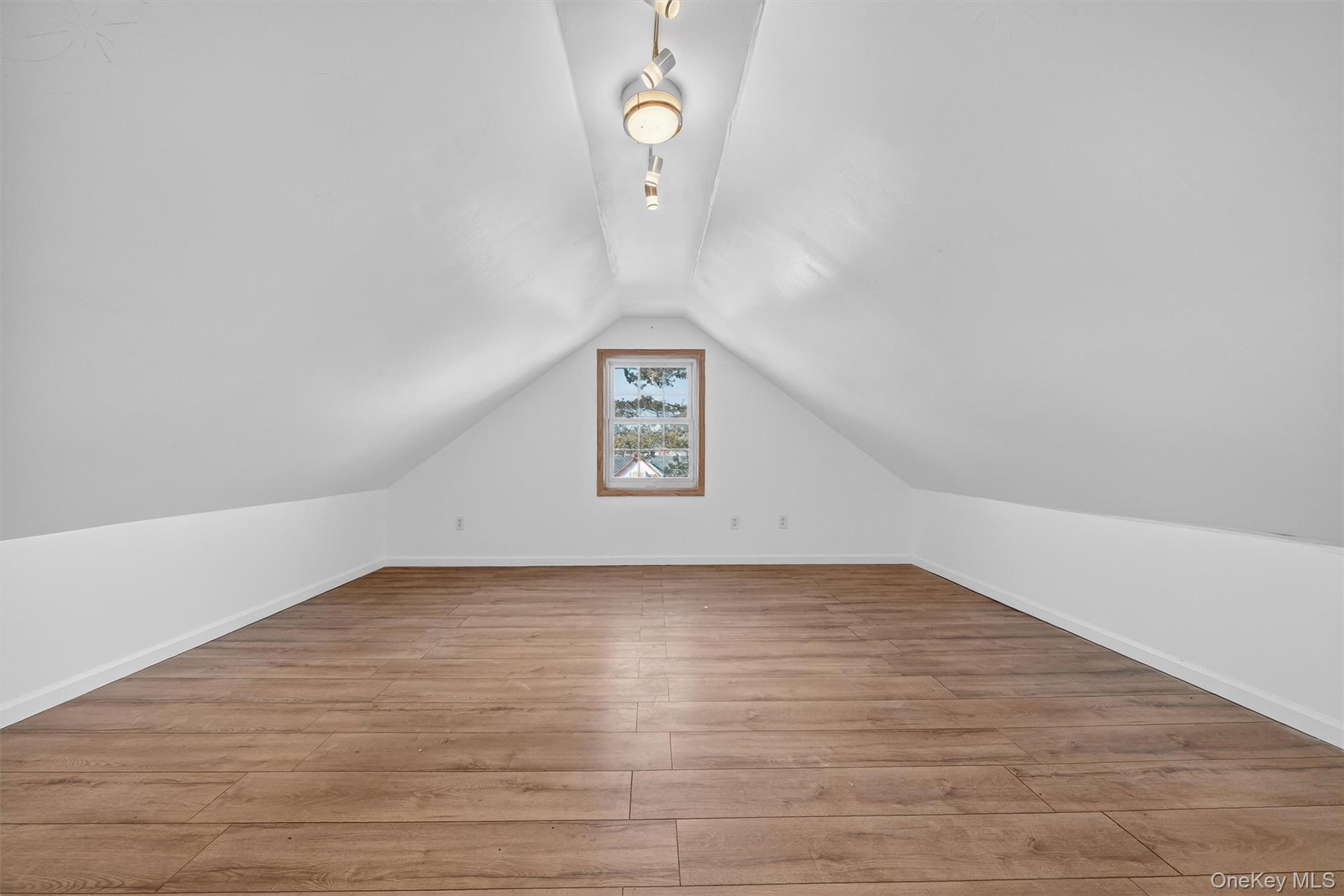 138-16 230th Street Queens, NY 11413 - Photo 35 of 49 Finished attic with light wood-type flooring