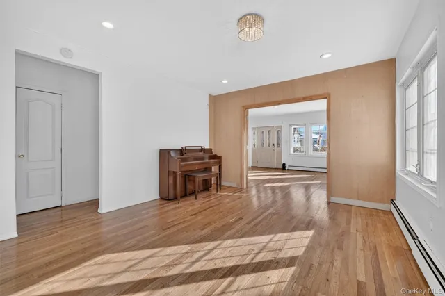 a view of kitchen with furniture and wooden floor