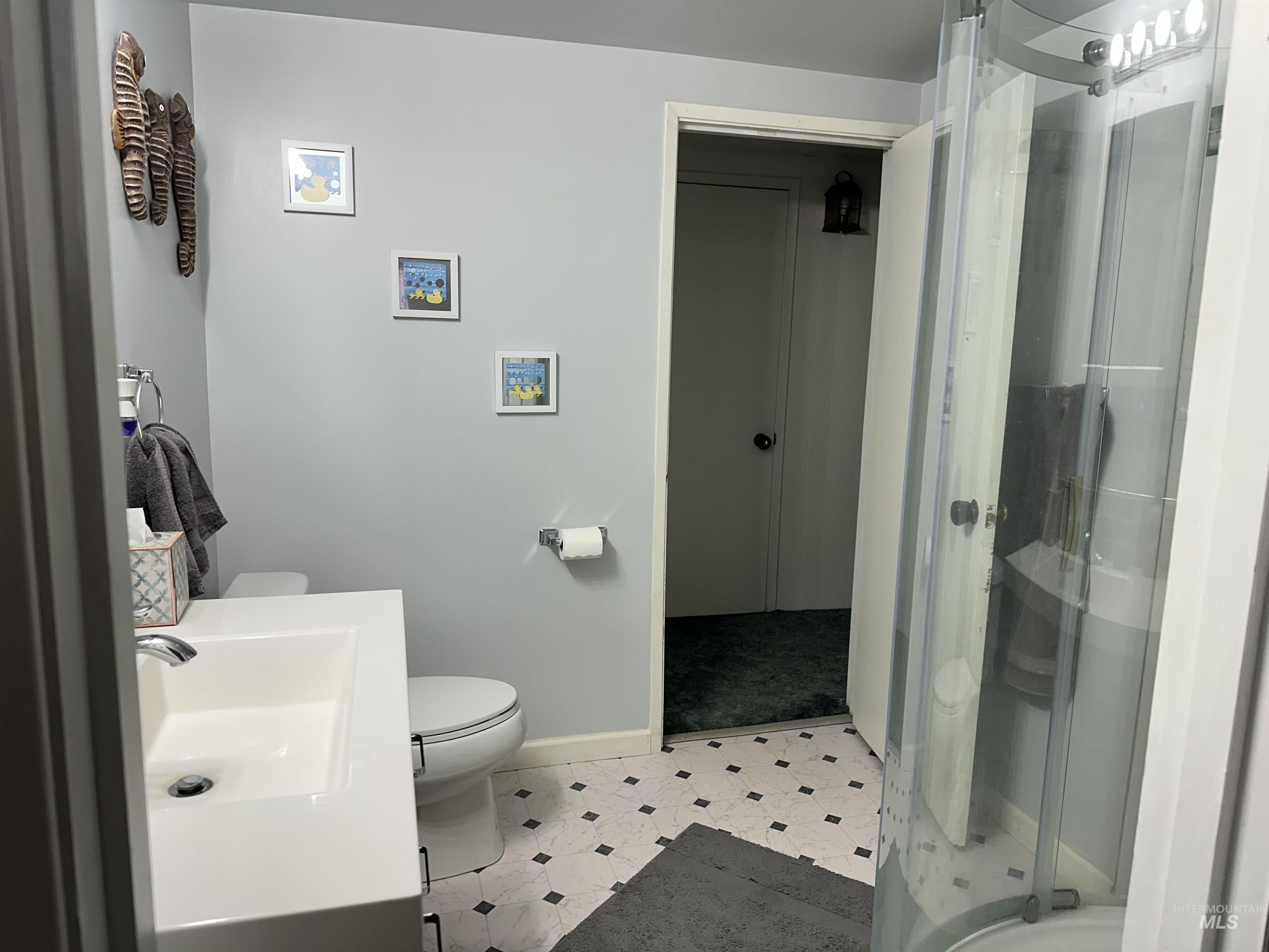 3214 Meadowlark Drive Lewiston, ID 83501 - Photo 17 of 25 Full bathroom with a stall shower, vanity, and light tile patterned floors