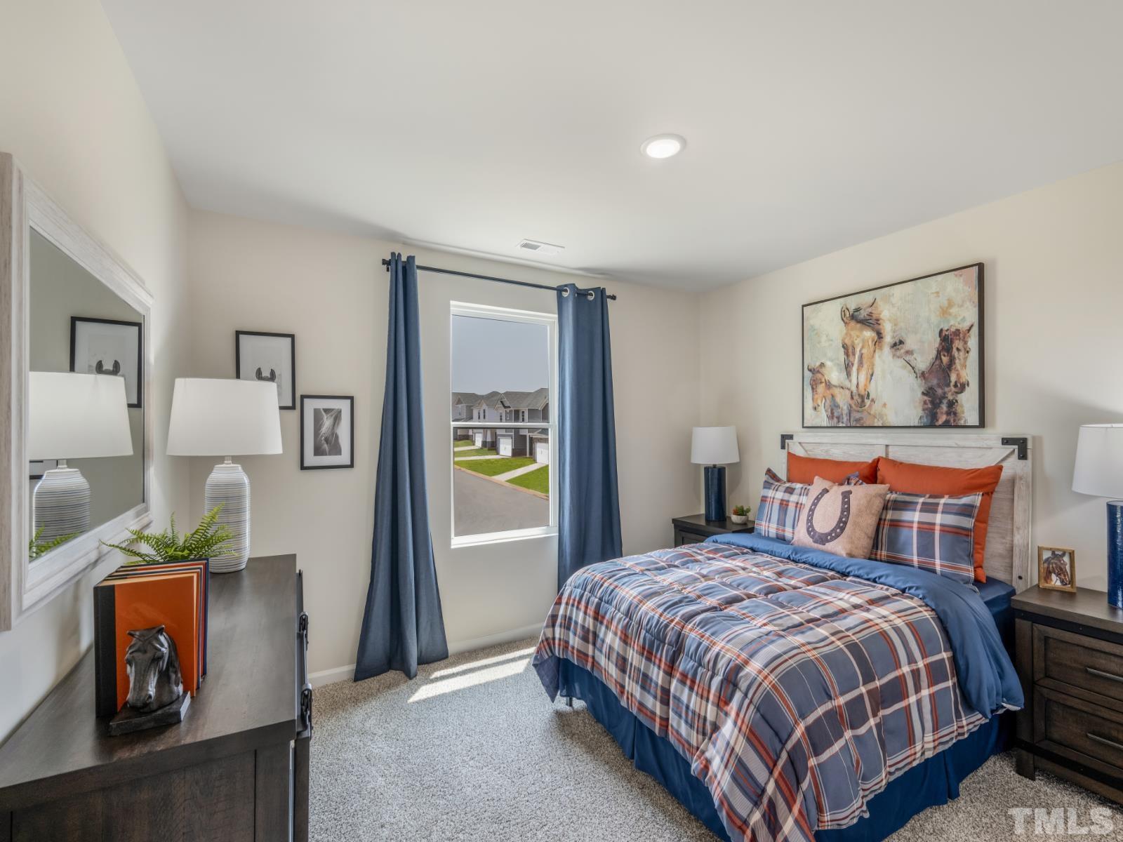 3005 Farndale Trace Durham, NC 27712 - Photo 6 of 14 a spacious bedroom with a bed and wooden floor