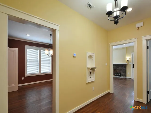 a bathroom with a sink a toilet and a window