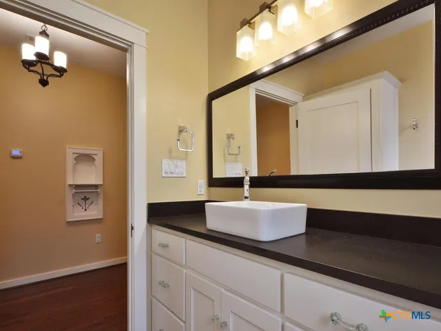 a bathroom with a tub and shower