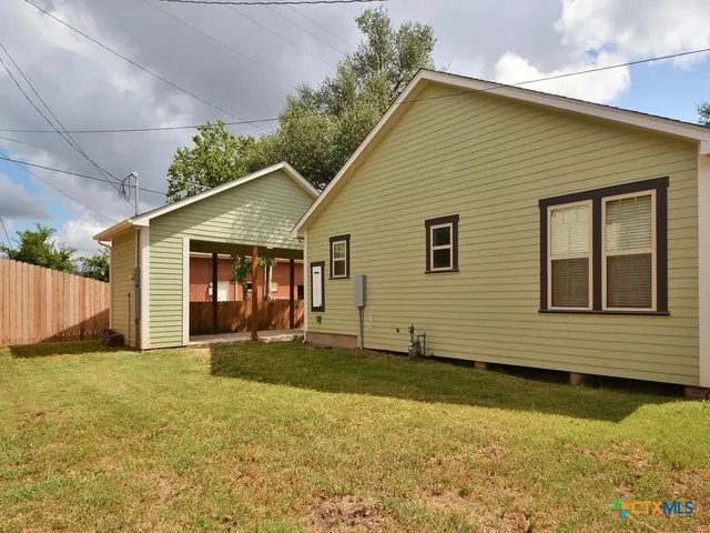 a front view of a house with a outdoor space