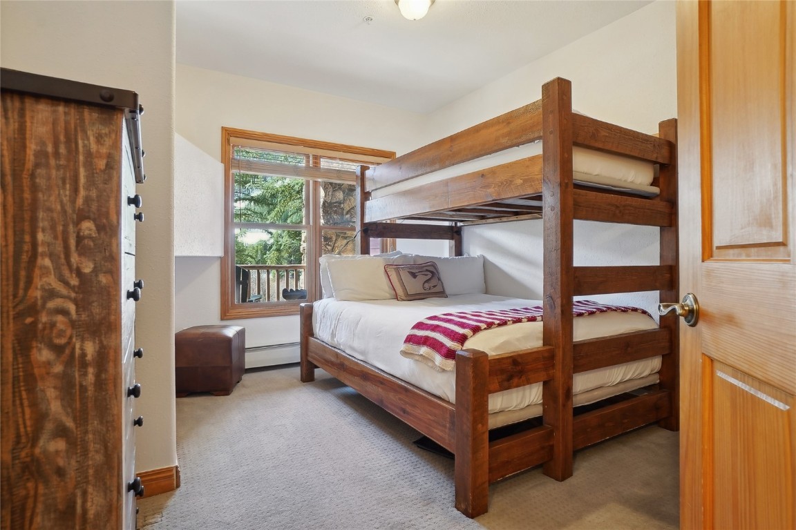 22714 Highway 6, Unit 5941 Keystone, CO 80435 - Photo 11 of 41 a bedroom with a bed and a window
