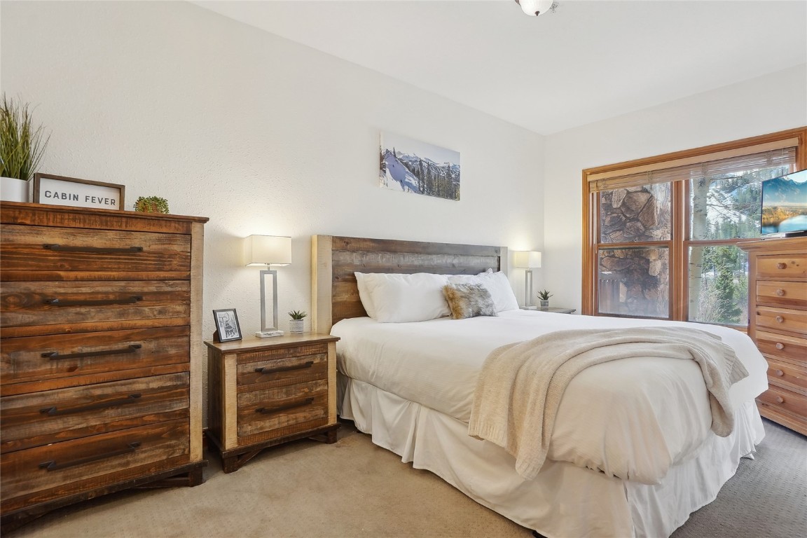 22714 Highway 6, Unit 5941 Keystone, CO 80435 - Photo 14 of 41 a bedroom with a bed and a window