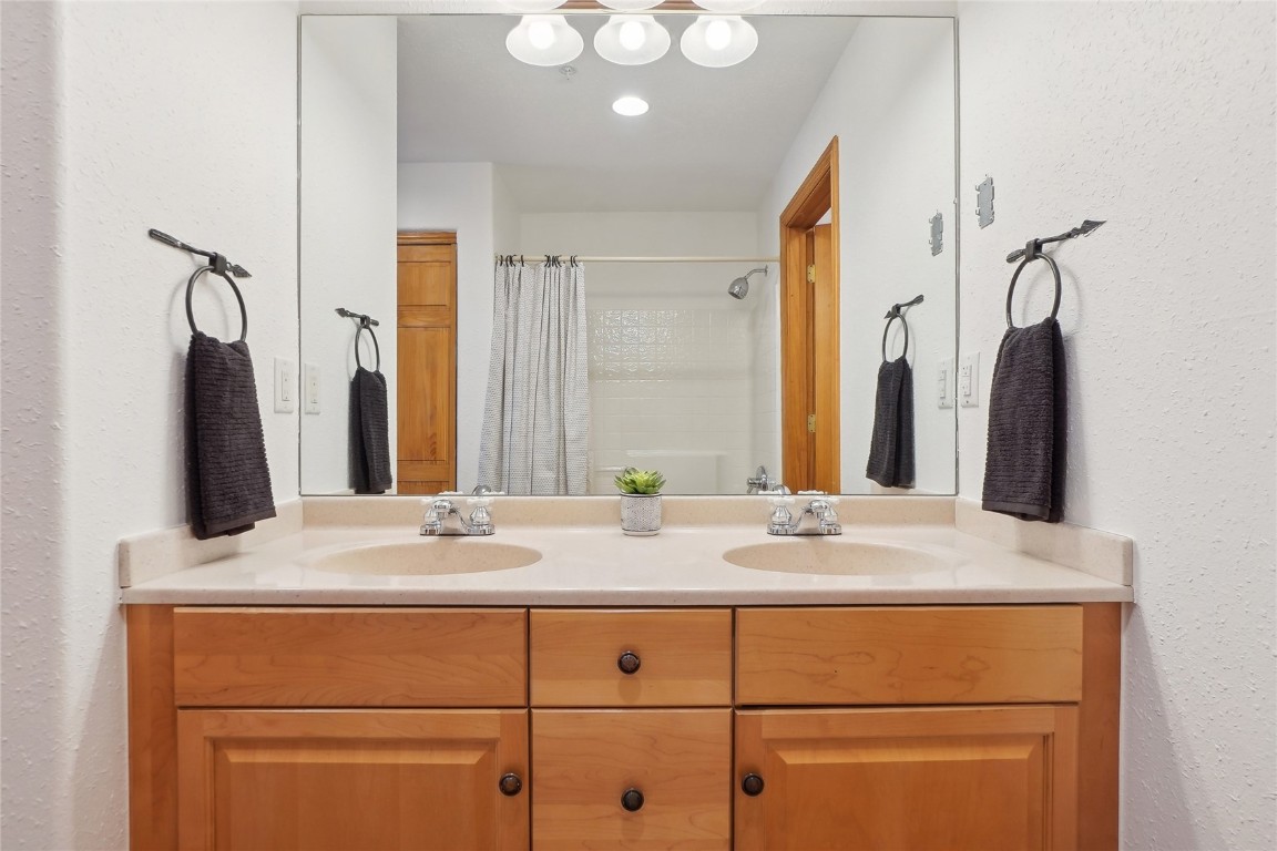 22714 Highway 6, Unit 5941 Keystone, CO 80435 - Photo 18 of 41 a bathroom with a sink vanity and mirror