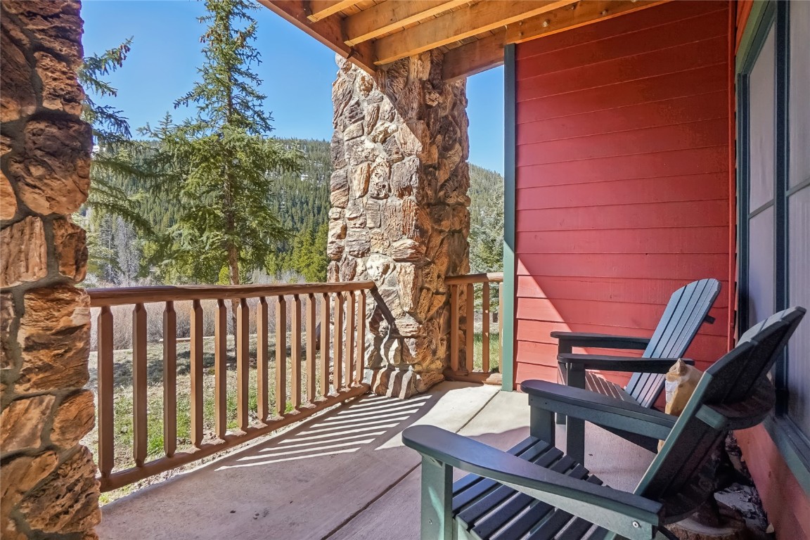 22714 Highway 6, Unit 5941 Keystone, CO 80435 - Photo 20 of 41 a view of balcony with wooden floor and fence
