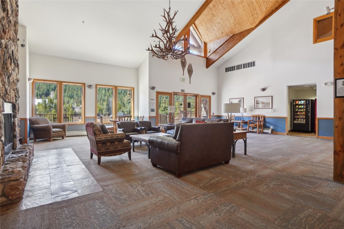 22714 Highway 6, Unit 5941 Keystone, CO 80435 - Photo 28 of 41 a living room with furniture dining table and a large window
