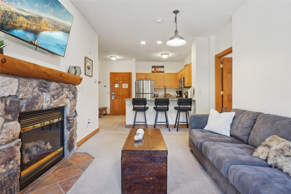 22714 Highway 6, Unit 5941 Keystone, CO 80435 - Photo 8 of 41 a living room with furniture and a fireplace