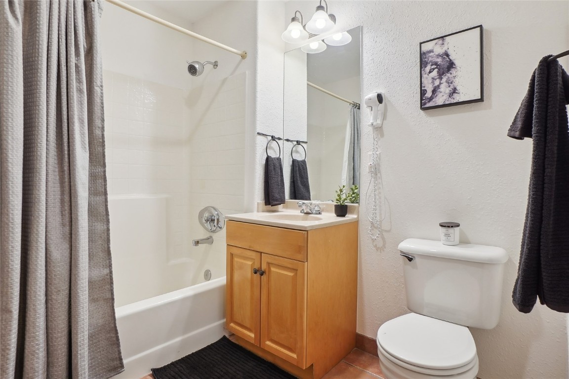 22714 Highway 6, Unit 5941 Keystone, CO 80435 - Photo 10 of 41 a bathroom with a sink a mirror a toilet and bathtub