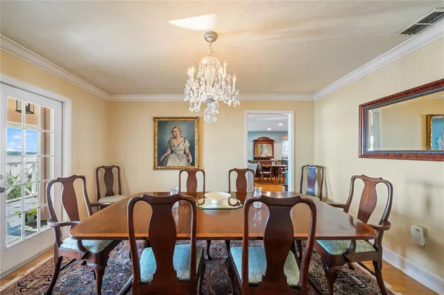 a bathroom with a double vanity sink a toilet a mirror and bathtub