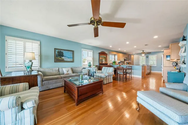 a kitchen with counter top space a sink a stove and cabinets