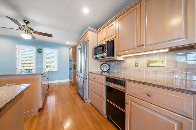 a bathroom with a sink a toilet and a shower