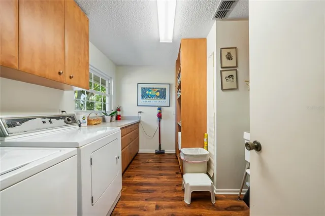 an aerial view of a house with garden space and street view