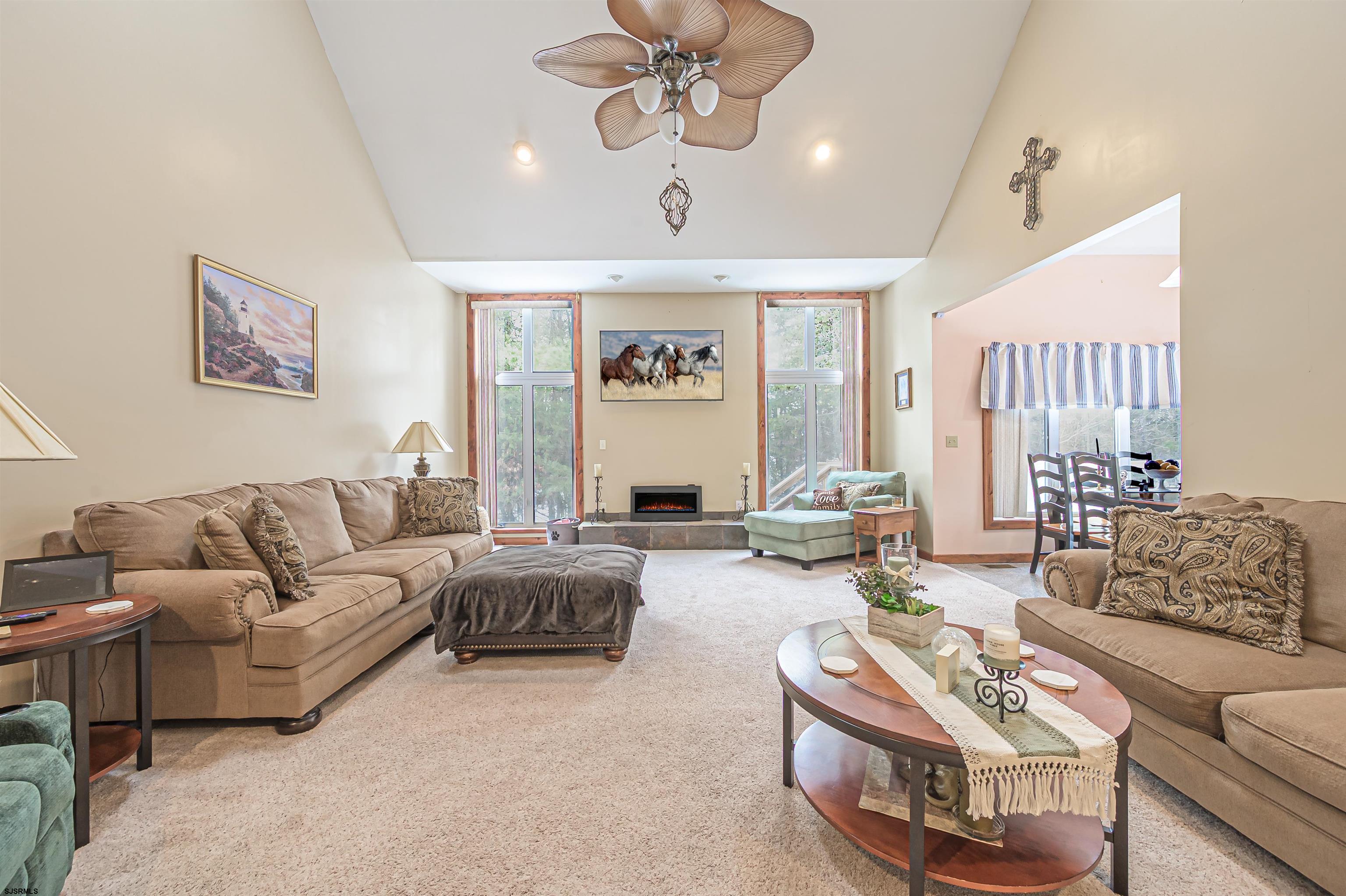 892 Hogbin Road Millville, NJ 08332 - Photo 17 of 63 a living room with furniture ceiling fan and a window