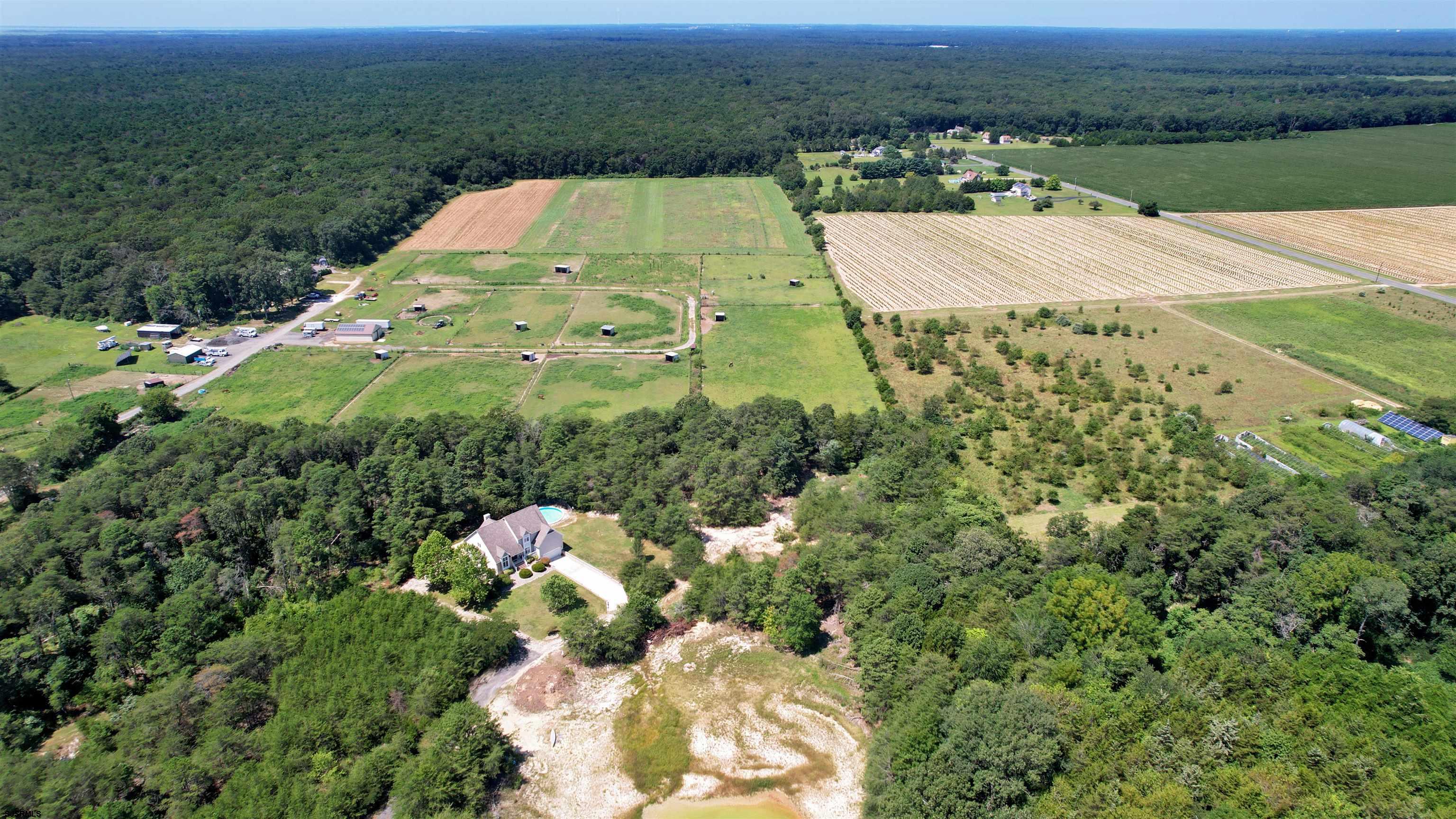 892 Hogbin Road Millville, NJ 08332 - Photo 50 of 63 an aerial view of a house with a yard and lake view