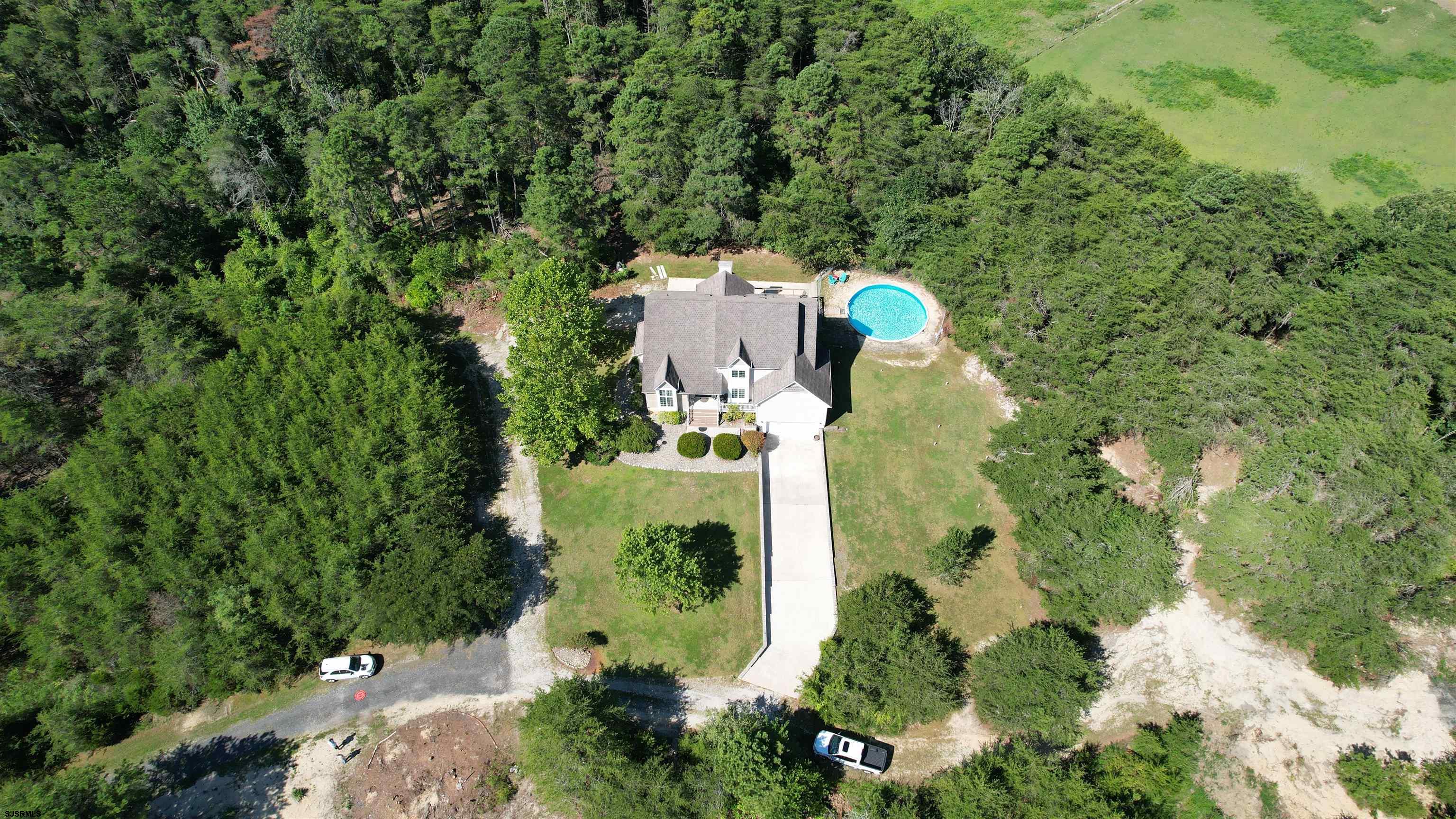 892 Hogbin Road Millville, NJ 08332 - Photo 55 of 63 an aerial view of a house with a yard and greenery