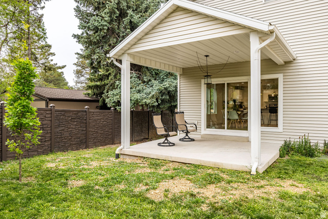 1552 Sumac Drive Logan, UT 84321 - Photo 53 of 72 Covered concrete patio with white vinyl siding exterior