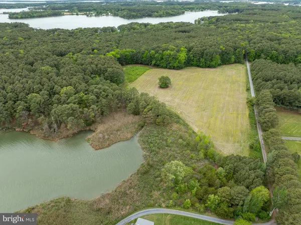 a view of a lake with a yard