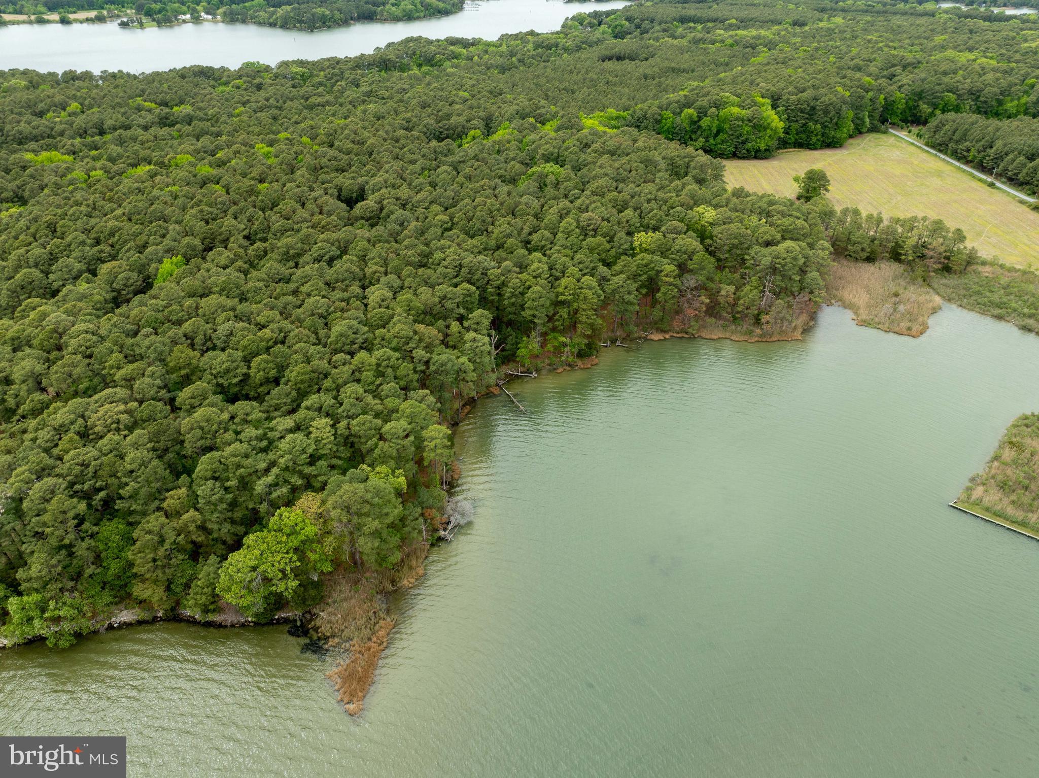 Quaker Neck Road Bozman, MD 21612 - Photo 4 of 9 a view of a lake with an outdoor space
