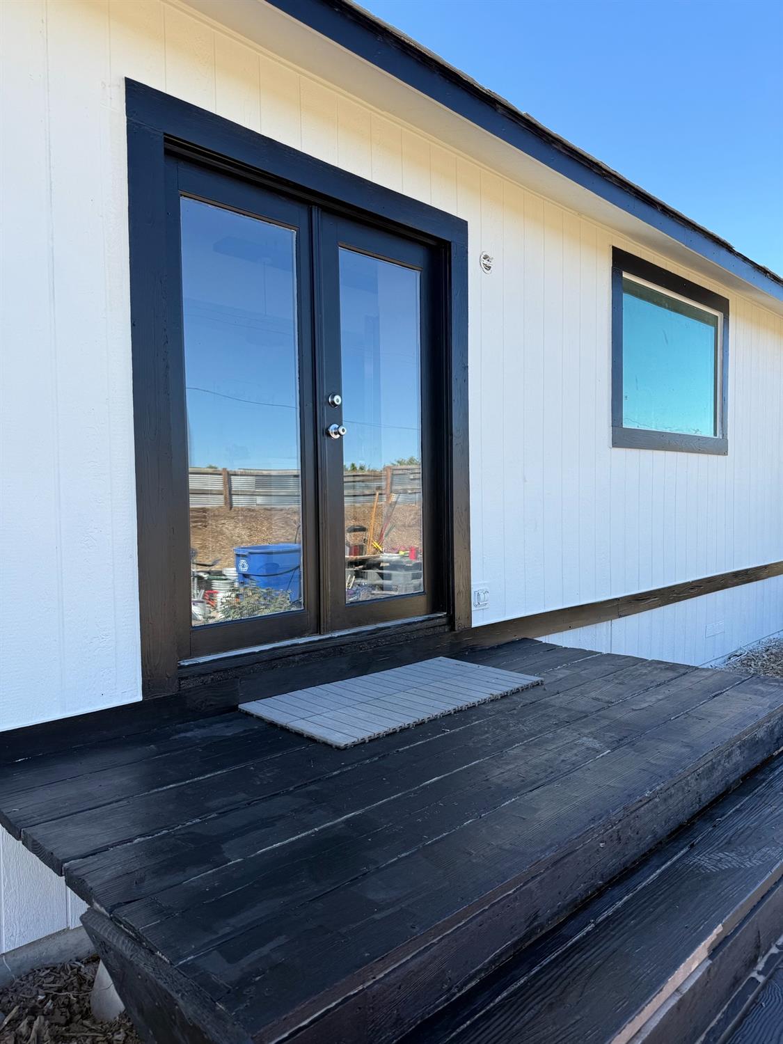 9641 Biederman Way Escalon, CA 95320 - Photo 1 of 1 a view of an empty room with wooden floor and a window