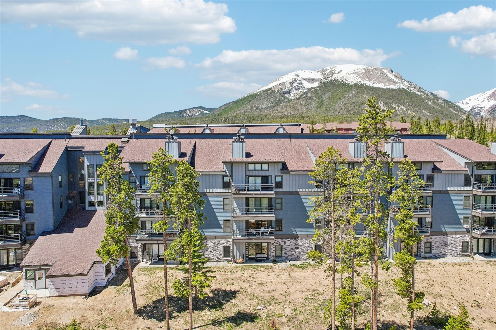 89310 Ryan Gulch Road, Unit 103 Silverthorne, CO 80498 - Photo 30 of 48 a view of building with an outdoor space and seating space