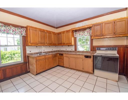 80 Grand Street Springfield, MA 01108 - Photo 11 of 24 a kitchen with a stove a sink dishwasher and a refrigerator