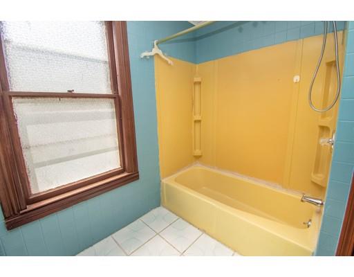 80 Grand Street Springfield, MA 01108 - Photo 19 of 24 a bathroom with a bathtub and a shower