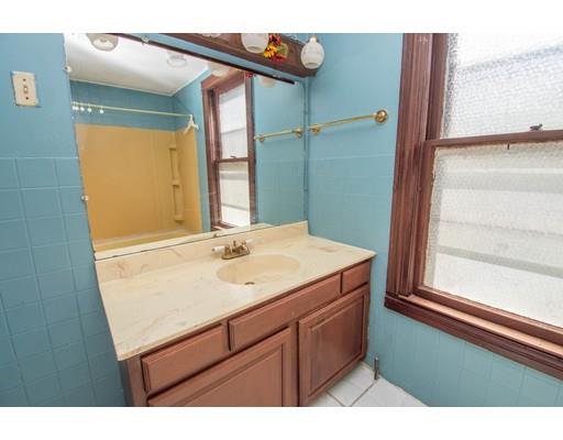 80 Grand Street Springfield, MA 01108 - Photo 20 of 24 a bathroom with a sink and a mirror