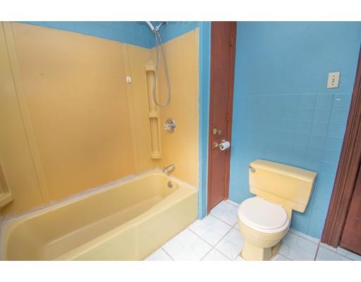 80 Grand Street Springfield, MA 01108 - Photo 21 of 24 a bathroom with a toilet and a shower