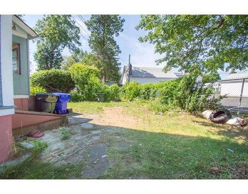 80 Grand Street Springfield, MA 01108 - Photo 23 of 24 a view of a backyard with plants and a patio