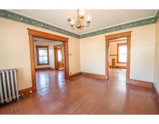 80 Grand Street Springfield, MA 01108 - Photo 5 of 24 a view interior of a house wooden floor stairs and a chandelier