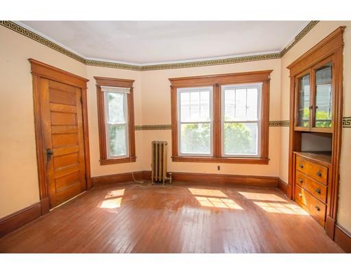 80 Grand Street Springfield, MA 01108 - Photo 6 of 24 a view of an empty room with a window and wooden floor