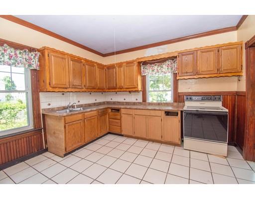 80 Grand Street Springfield, MA 01108 - Photo 9 of 24 a kitchen with a stove a sink dishwasher and a refrigerator