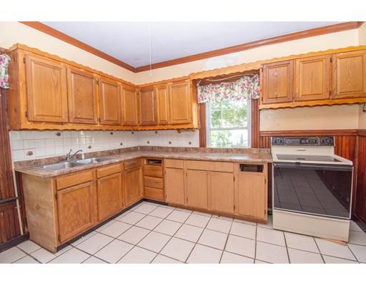 80 Grand Street Springfield, MA 01108 - Photo 10 of 24 a kitchen with stainless steel appliances a stove a sink and a microwave