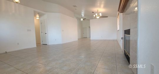 1309 Sims Street Ridgecrest, CA 93555 - Photo 2 of 31 a view of a hallway with chandelier