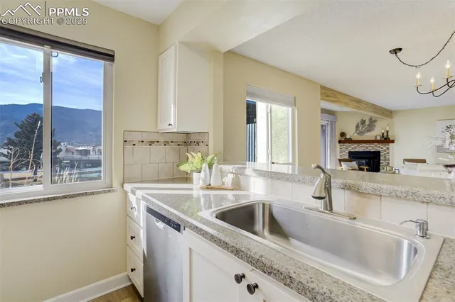a kitchen with a sink and a refrigerator