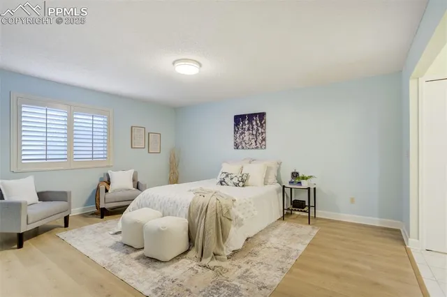 a bedroom with a bed and a couch