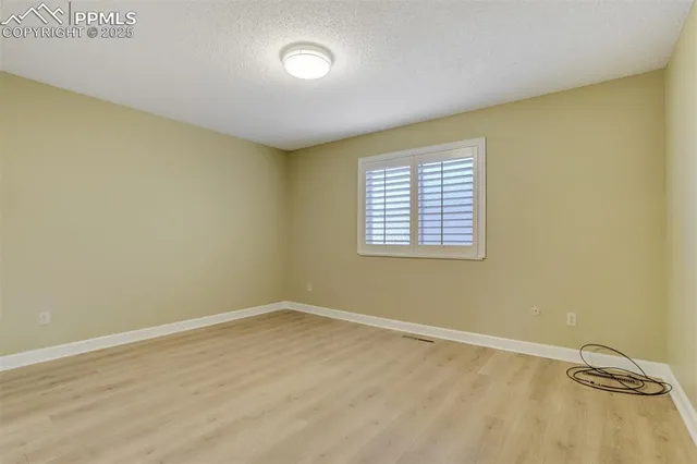 an empty room with a empty space and a window