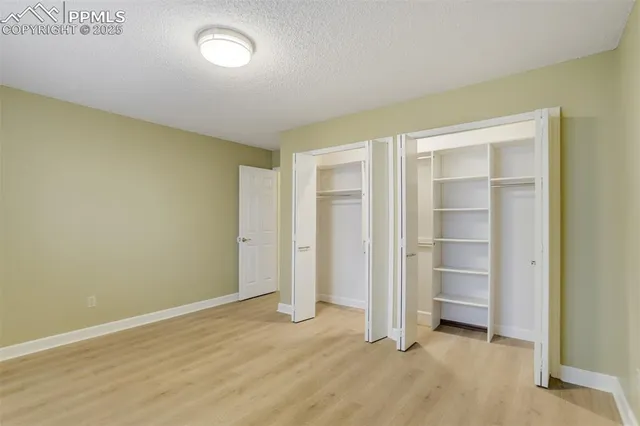 an empty room with closet area
