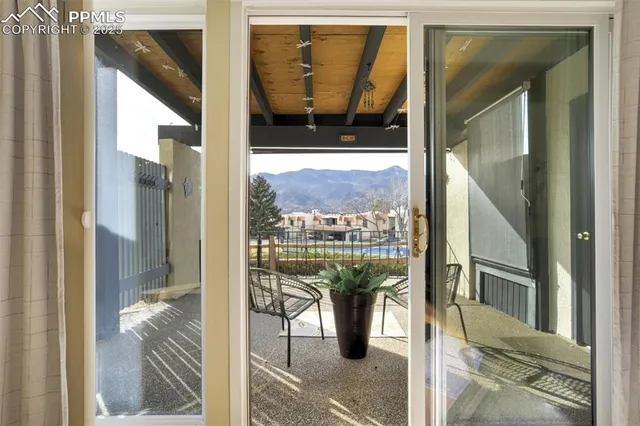 a picture of a glass door with a balcony view