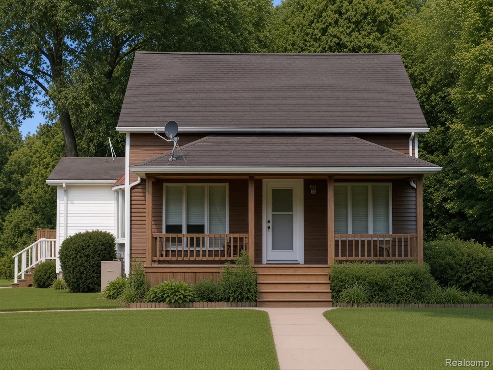 8922 Stone Road Algonac, MI 48001 - Photo 1 of 15 Two-story siding exterior with a covered front porch, dark shingle roof, and light-colored front door