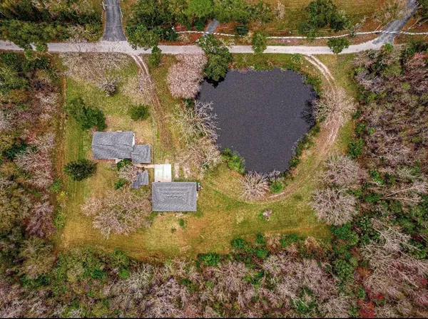an aerial view of residential house with outdoor space and swimming pool