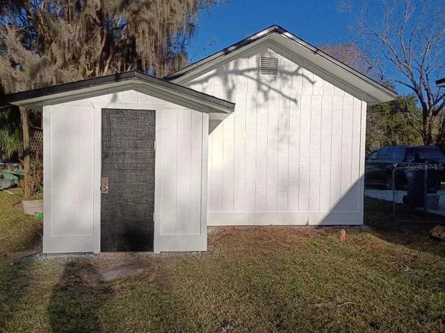 a view of backyard with green space
