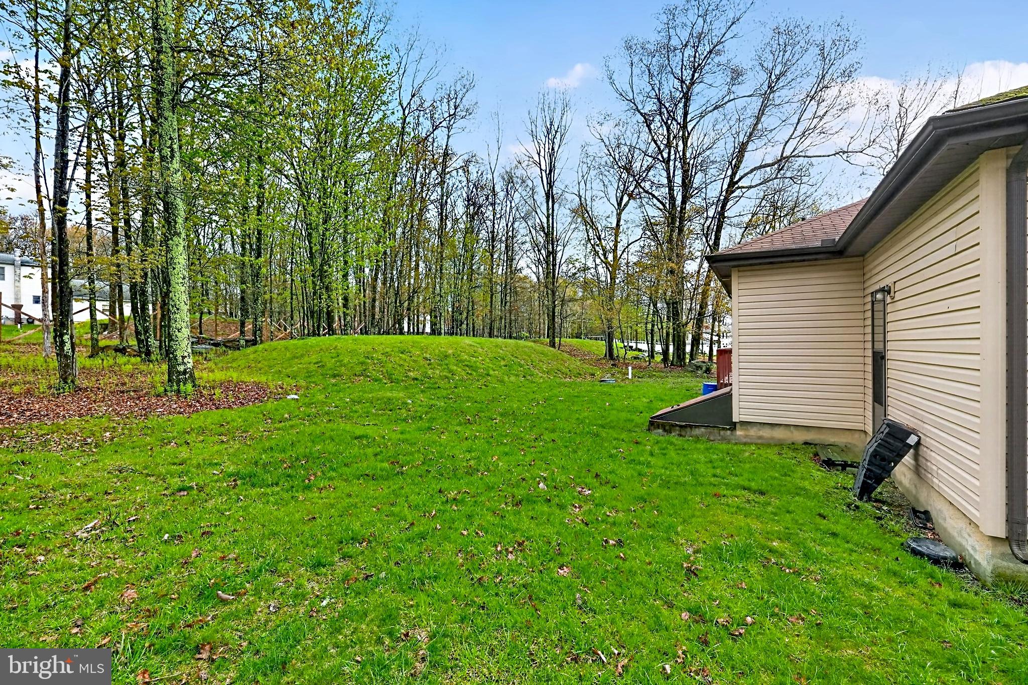 4341 Pine Ridge Drive East Bushkill, PA 18324 - Photo 16 of 19 a view of a backyard with large trees