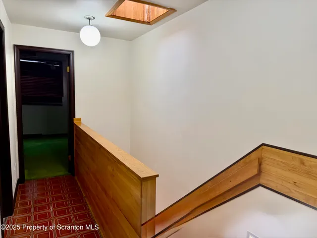 a view of an entryway with hallway