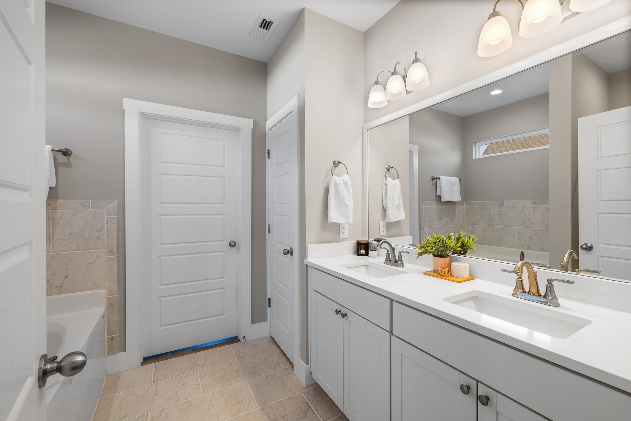 3200 Rucker Road Christiana, TN 37037 - Photo 12 of 31 a bathroom with a double vanity sink a mirror and a shower