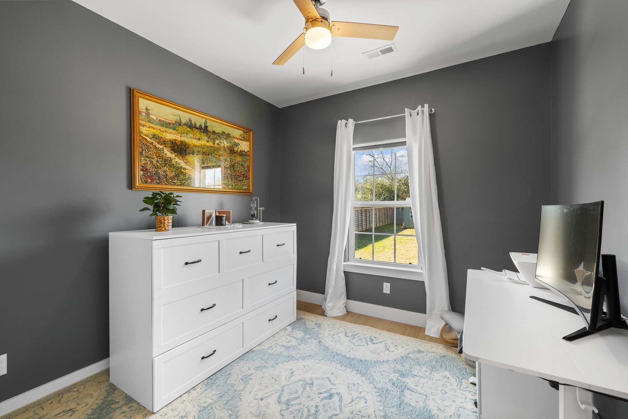 3200 Rucker Road Christiana, TN 37037 - Photo 17 of 31 a bedroom with a bed and a flat tv screen on the dresser