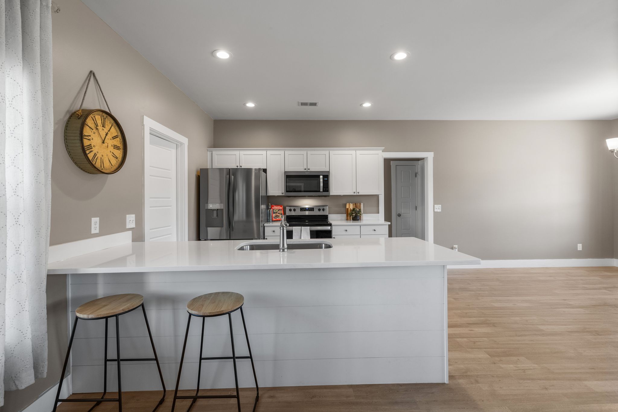 3200 Rucker Road Christiana, TN 37037 - Photo 8 of 31 a large kitchen with stainless steel appliances a large counter top and a refrigerator