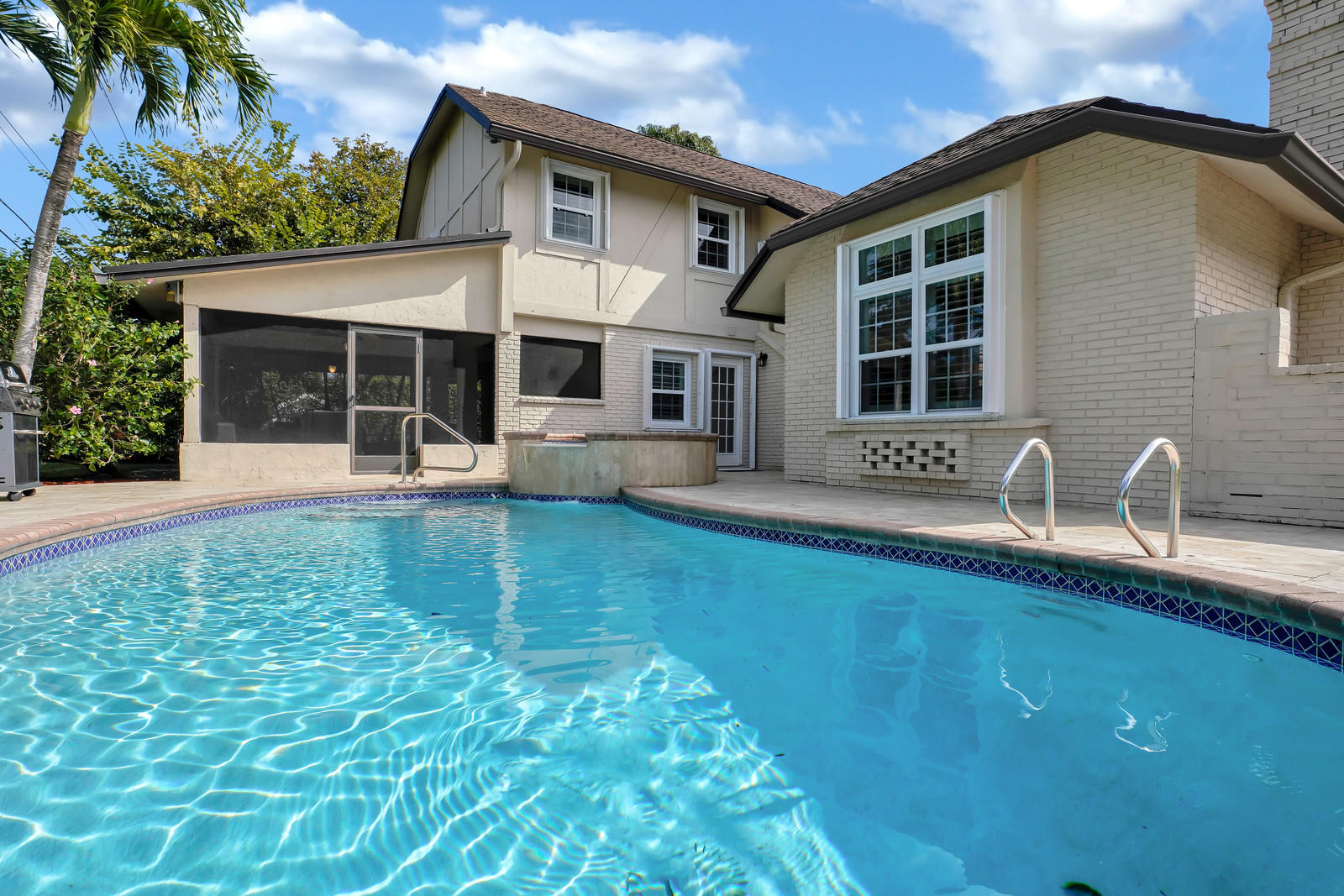 979 Southwest 18th Street Boca Raton, FL 33486 - Photo 27 of 30 a front view of a house with garden
